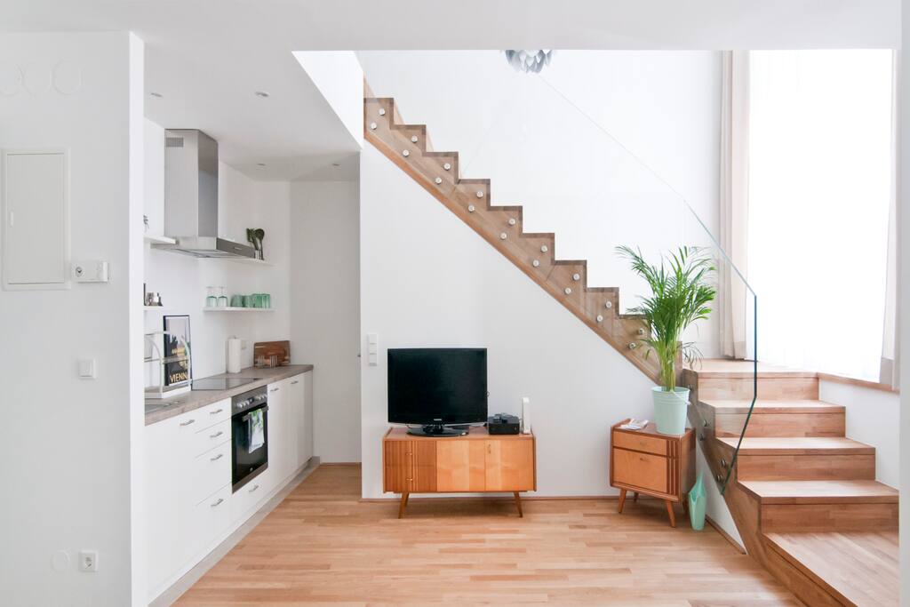Kitchen, media area, staircase to the entresol