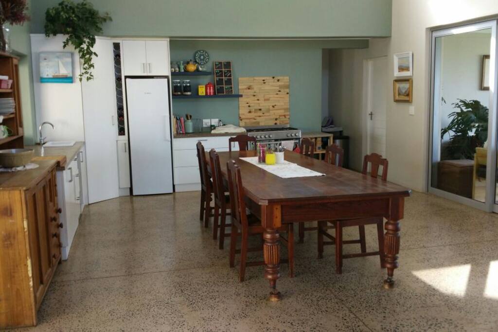 Dining room come kitchen with an 8 to 10 seater table for those more socially inclined