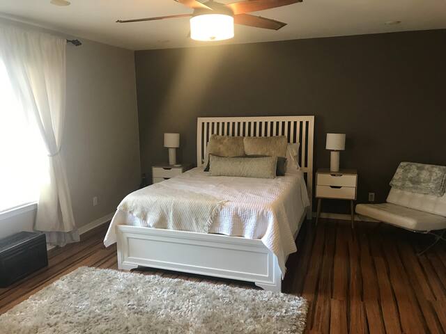 Master bedroom w/ en suite bathroom and pool