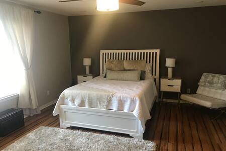 Master bedroom w/ en suite bathroom and pool