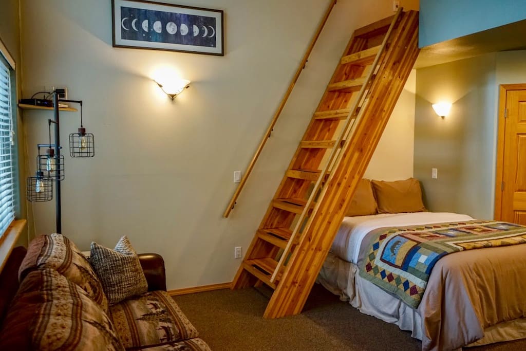 View of the "stairs" to the loft and first floor queen size bed. **The ladder is the only way into the loft