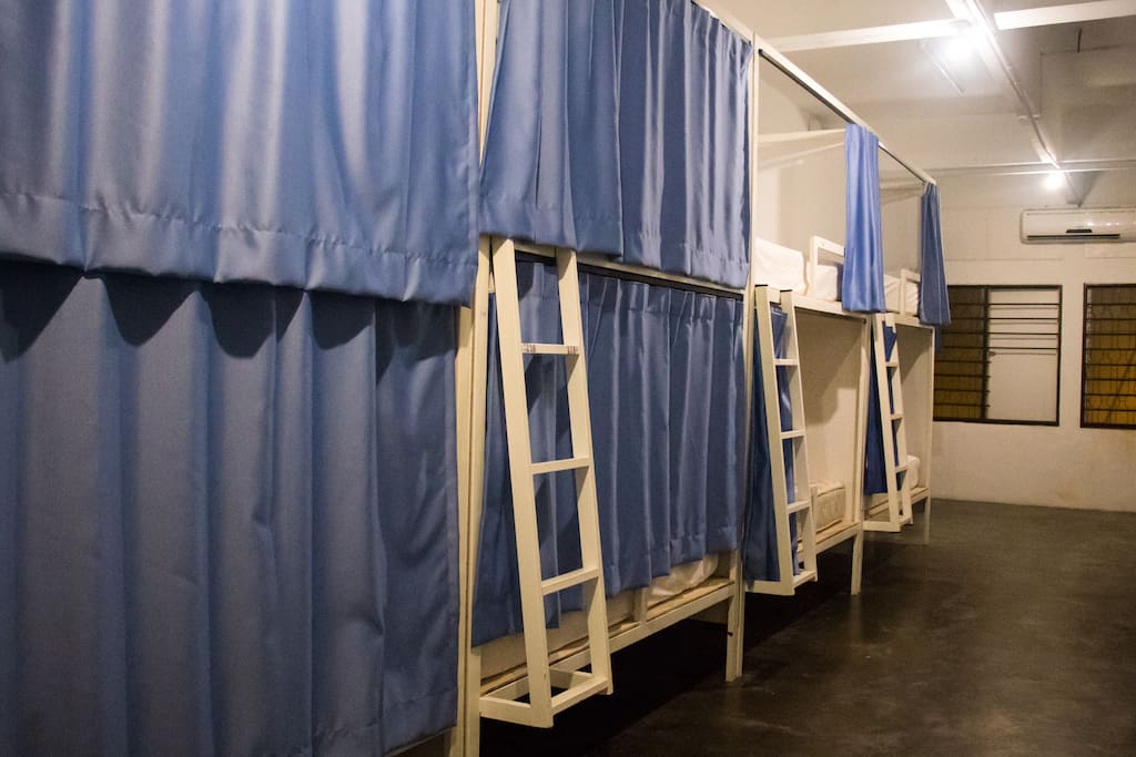 PRIVATE CURTAINED BEDS WITH LIGHTS AND AIRCON