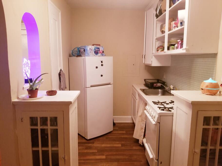 kitchen with plenty of dishes and cooking utensils