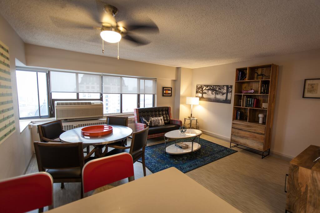 Living/dining area with wrap around windows