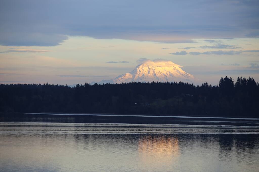 View of Mt. Rainier from balcony with chairs, table and propane grill.