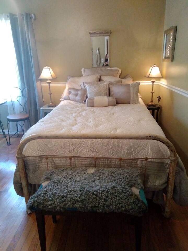 Your cozy bed awaits. Sealy posturpedic queen sized mattress on an antique metal bed frame with luxurious European linens and bedding. The room is inspired by my travels in France and decorated with this in mind. 