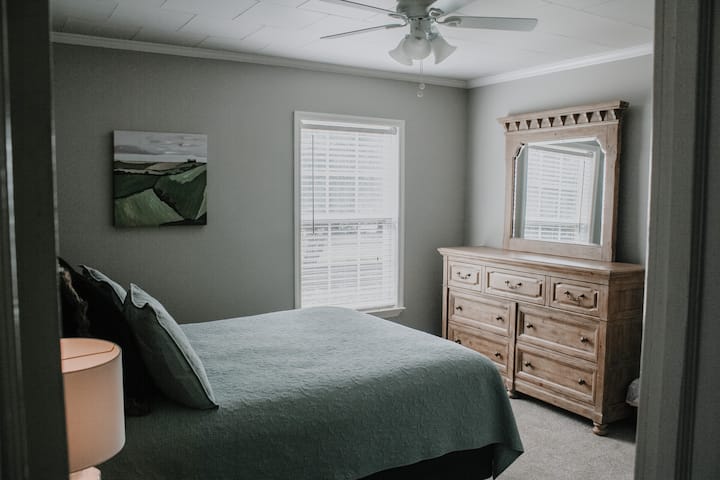 Bedroom with queen sized bed.