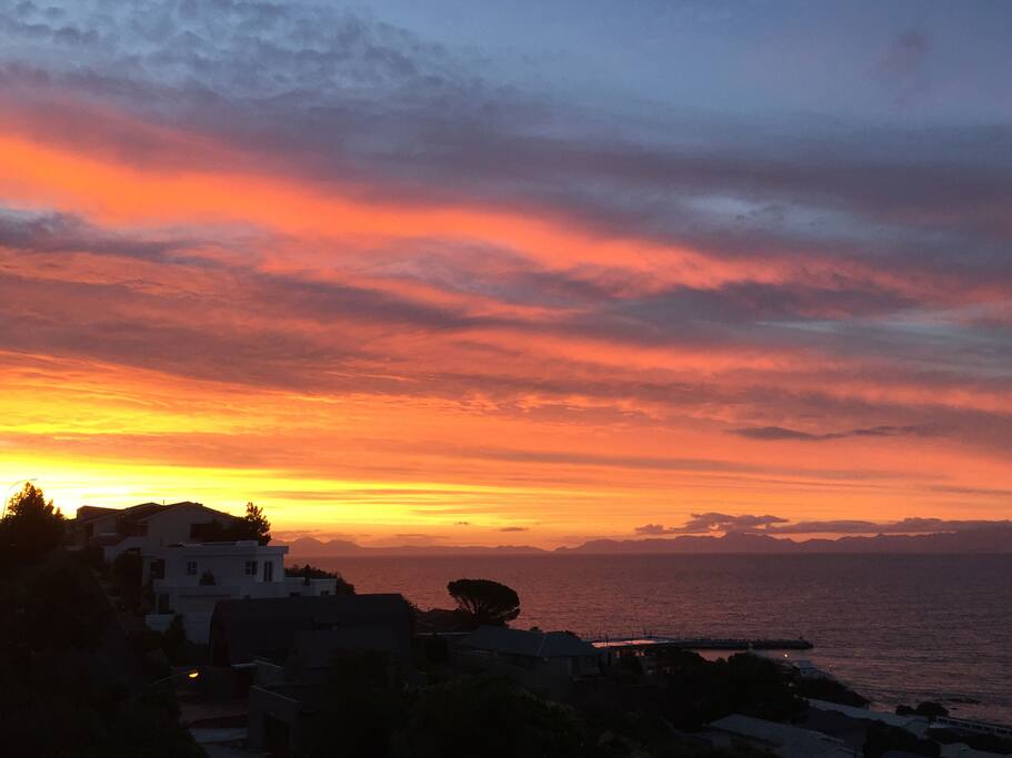 Evening sunset over False bay, with Table mountain in the background.