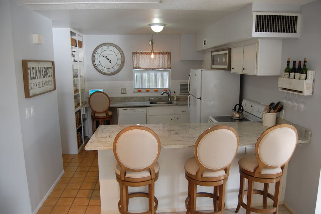 bar stools at granite kitchen counter