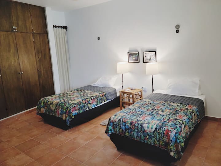 Garden-facing twin room with sofa bed. Great for the kids!