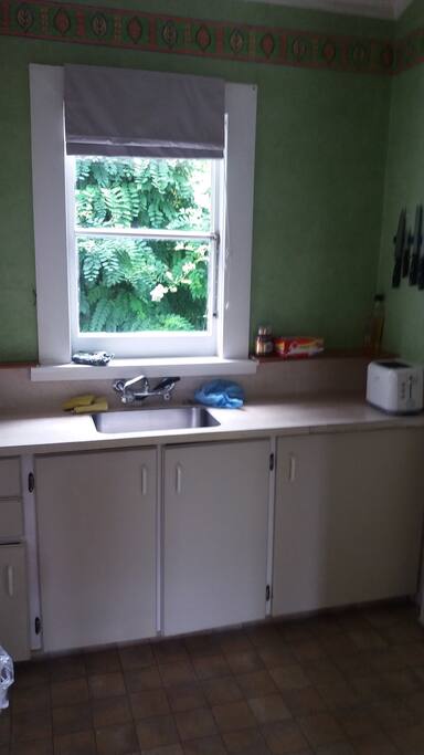 Small but convenient. Stove, small fridge and small freezer in laundry