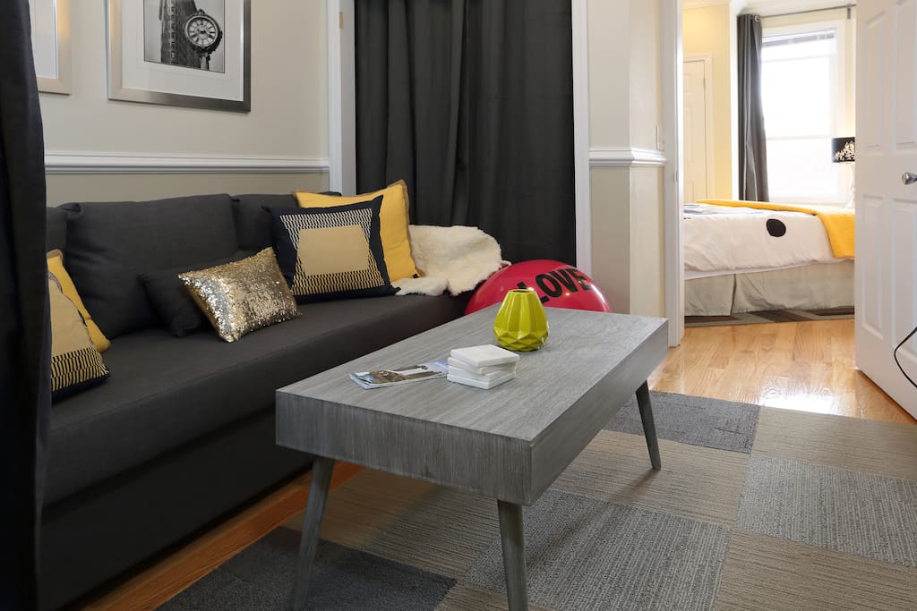 Pull the coffee table to the side and fold down the sofa