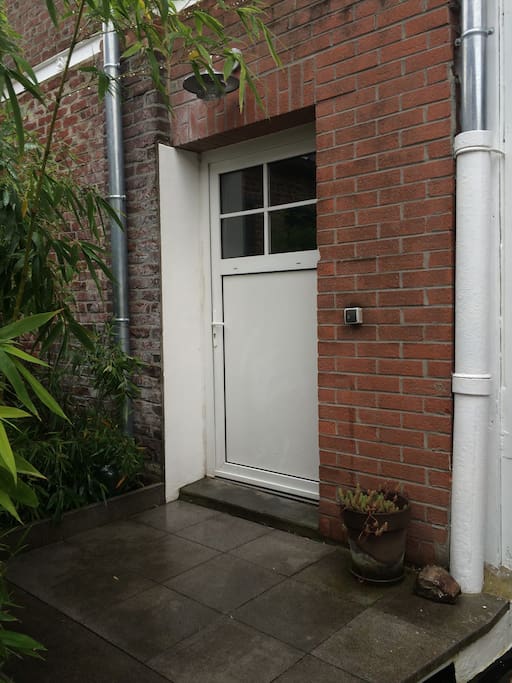 The door to the hallway that leads you to your house