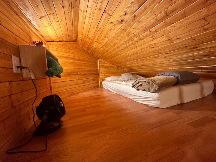 loft bed above kitchen in main cabin.