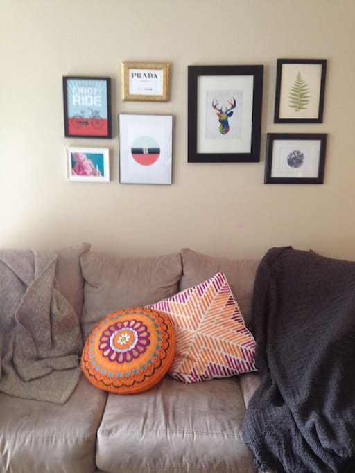 Artwork on top of a very big and comfy couch