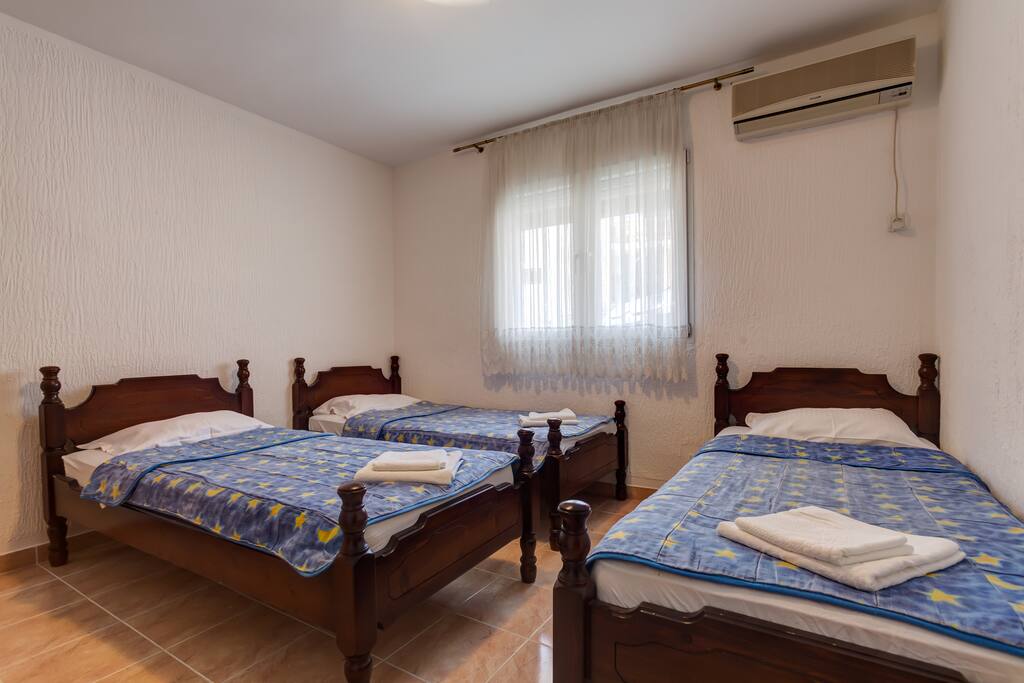In first room you have the possibility to use three single beds, air conditioning and a walk-in wardrobe also.