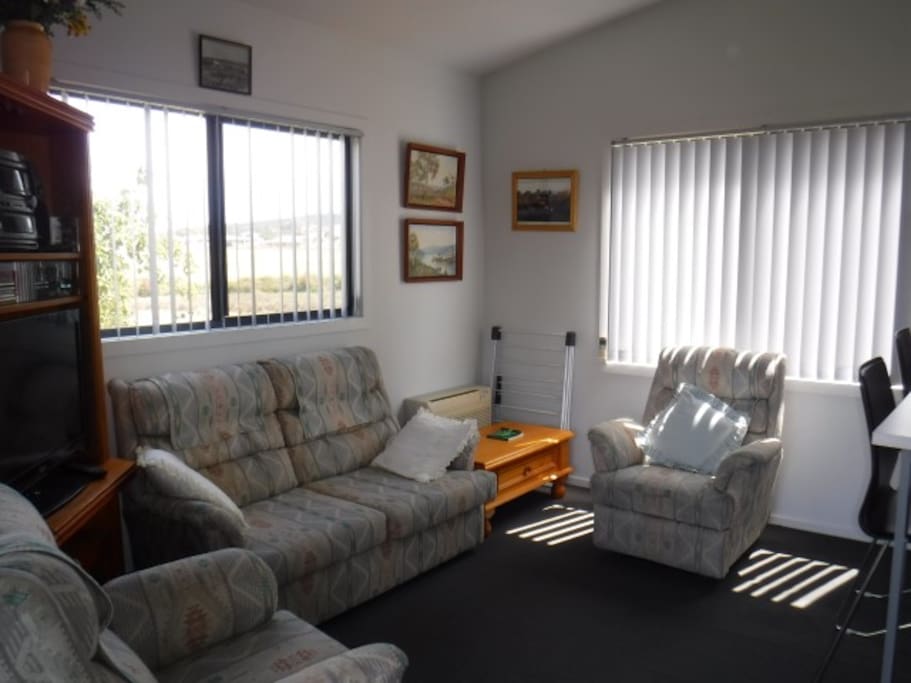 The living area has views over horse paddocks, small vineyard and orchard.