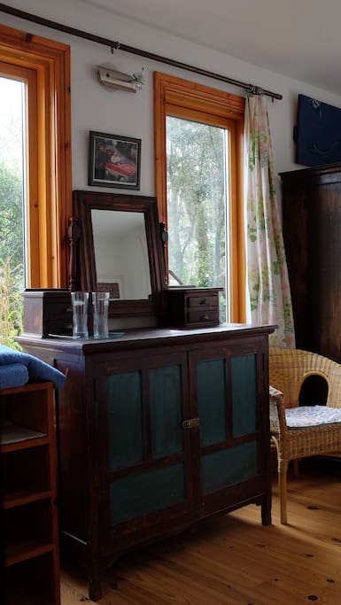 Antique dressing table with windows onto the garden either side.