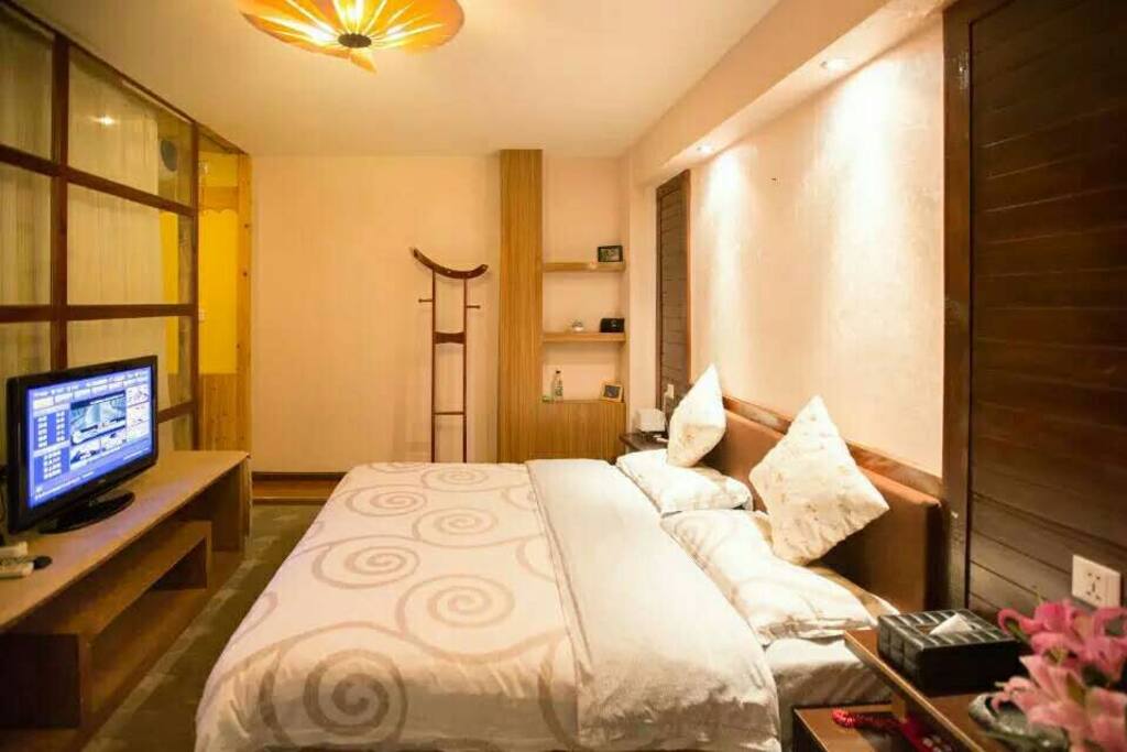 Clean bed with TV and ensuite bathrooms at your utmost comfort.