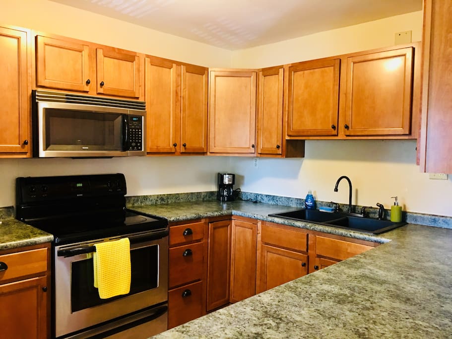 Updated and spacious kitchen with stainless steel appliances , and plenty of storage.