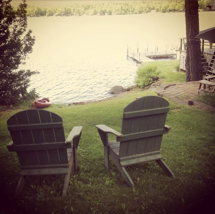 The view from the door of the cottage to the lake and kayak area
