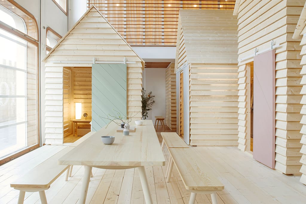 KOTI (Finnish for "home") transforms the Institut finlandais to bring the magic of the communal cottage experience to Paris's Rive Gauche. Each evening, up to 12 guests can book from a selection of six spruce timber aitta. Each day, the installation is open for the public to visit.