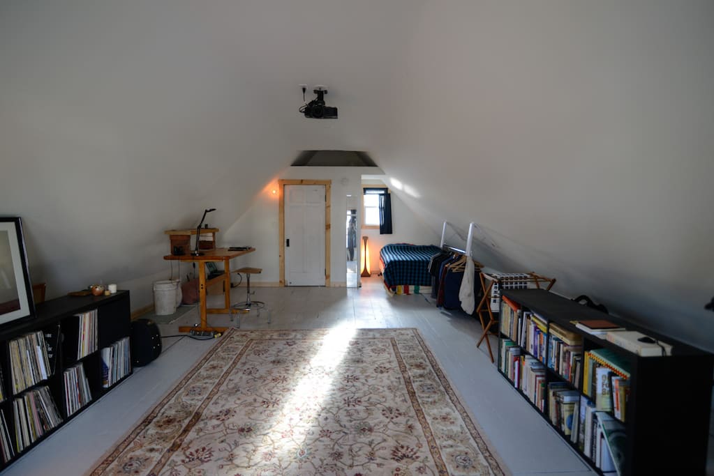 This is The Loft. It has plenty of natural light in the morning and afternoon. The space is grand and it's all yours.