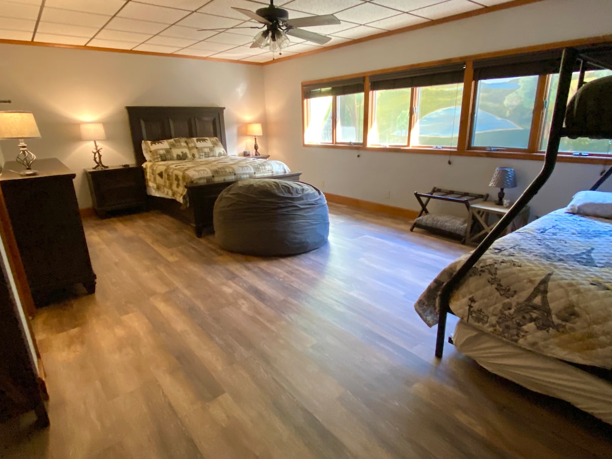 Lower level bedroom with Queen, twin over Full bunk, and framed floor mattress 