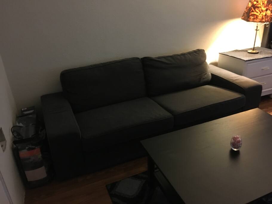 Comfortable new couch, to Lounge or rest on. (To the left of the couch has an blow up mattress)
