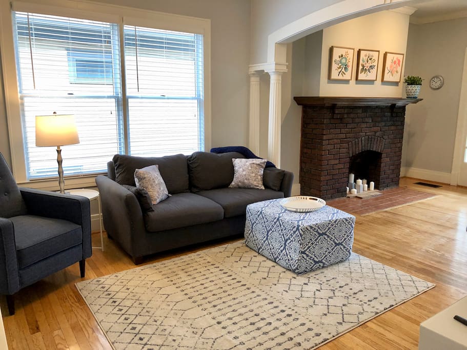 Wide open living room with plenty of seating and charm.