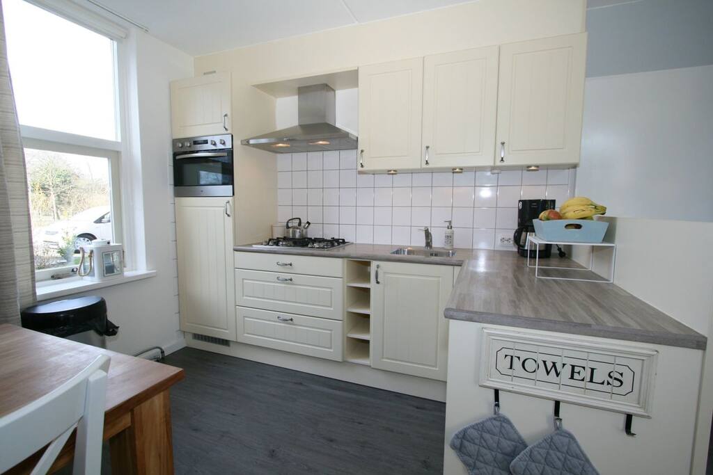 Kitchen including dishwasher, microwave and oven