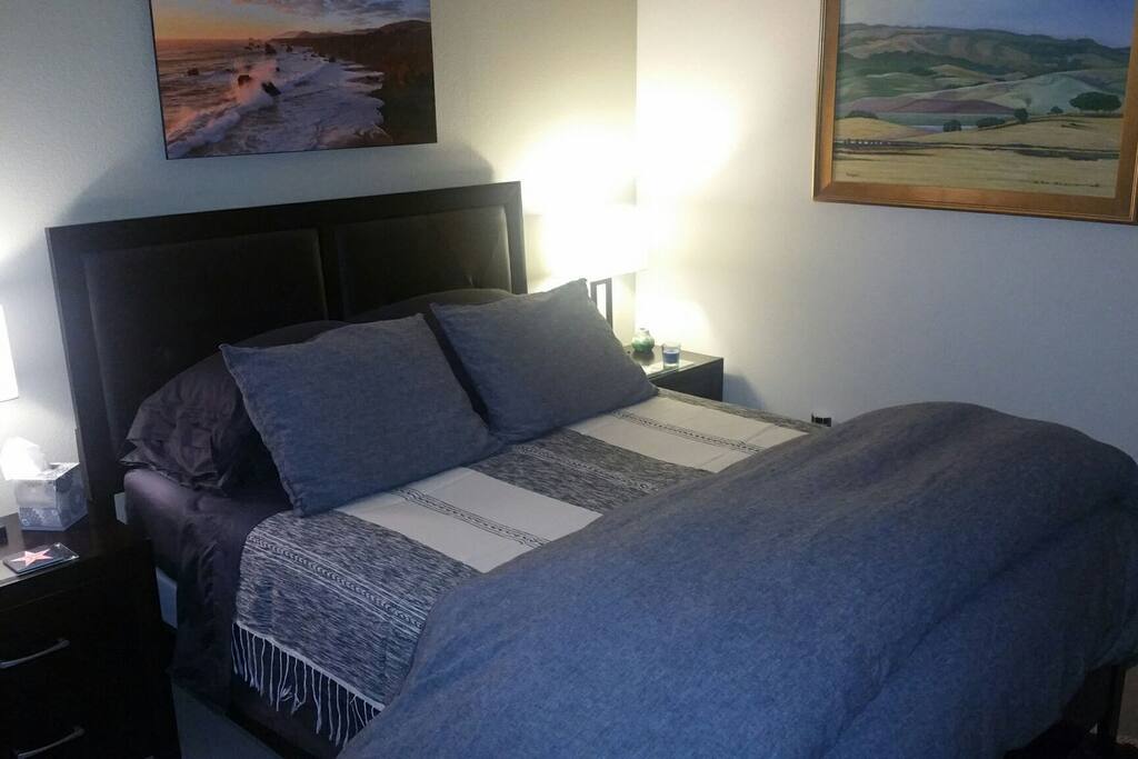 Feather pillow mattress cover on top of a new box spring and medium firm mattress supports a fIrm yet cushy soft sleeping experience.