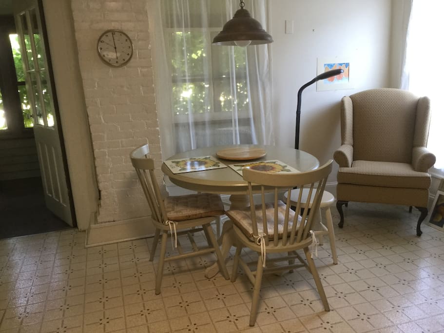 Other end of kitchen, showing screened porch through door