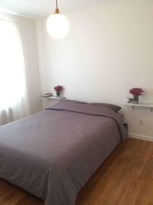 Spacious bedroom with lots of natural sunlight and walk-in closets