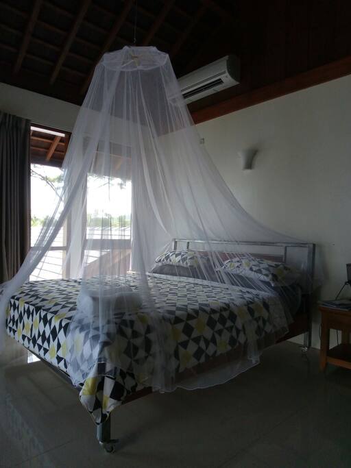 the bed with new mosquito net