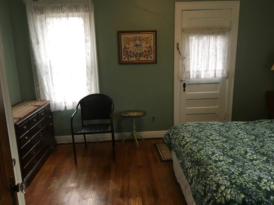 Roomy bedroom with dresser and closet