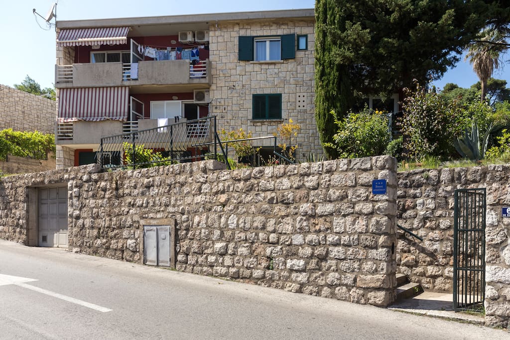 Entrance from the street to the apartment complex with stairs