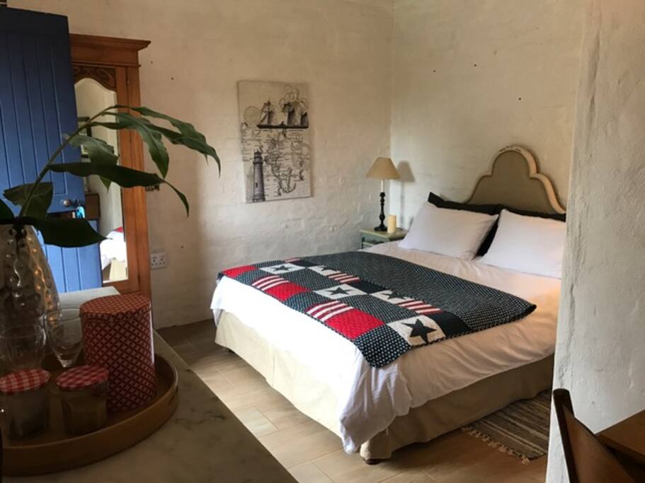 The queen bed overlooks the secluded garden