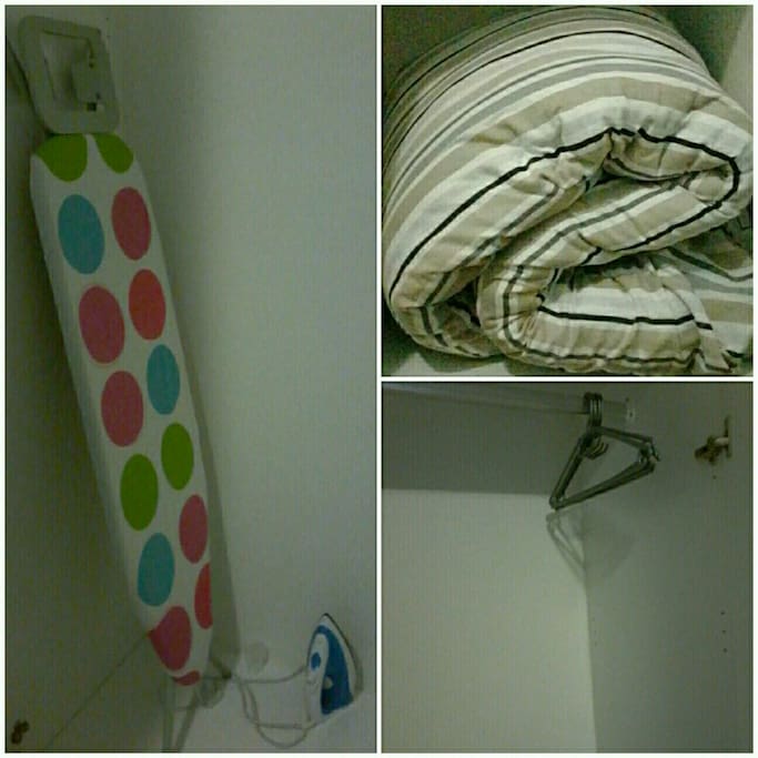 Duvet, iron, clothing hangers and ironing board