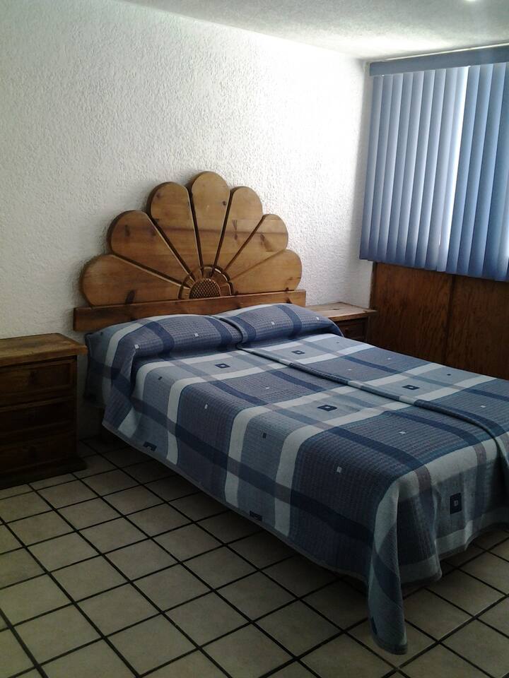 B) Suites Libertad Modest, comfortable, affordable. Apartments for