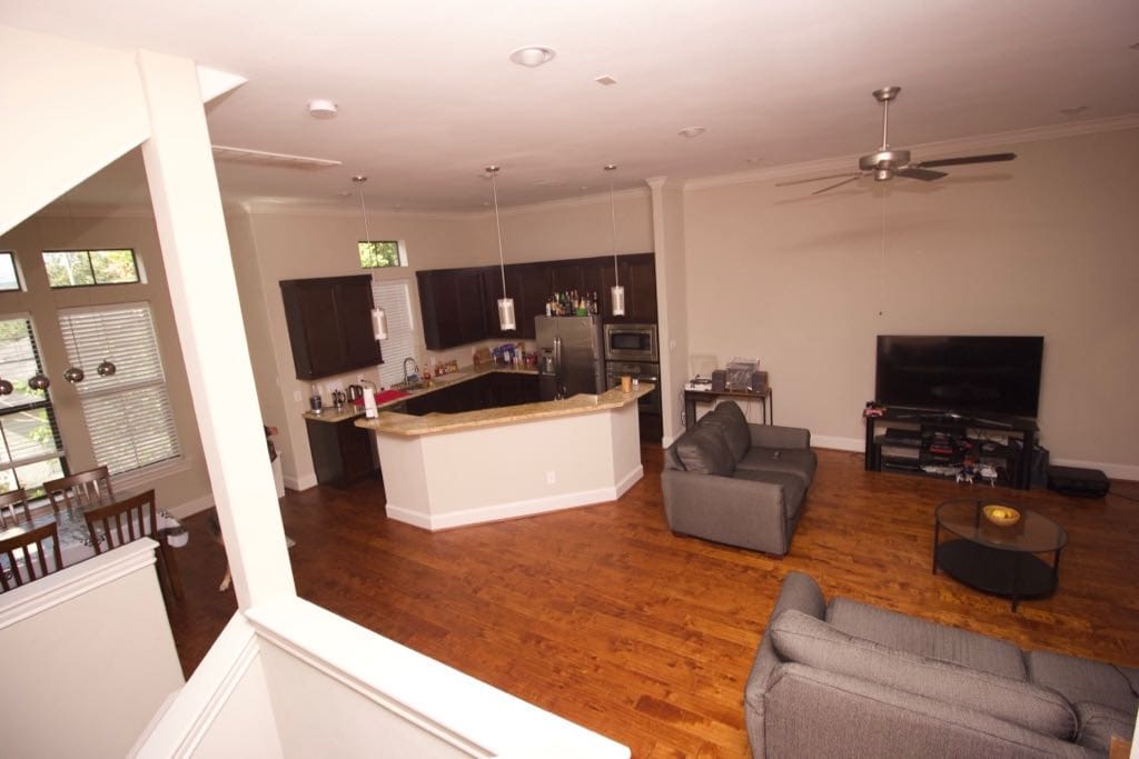 Upstairs living area has a full kitchen, breakfast space, guest bathroom and a balcony.