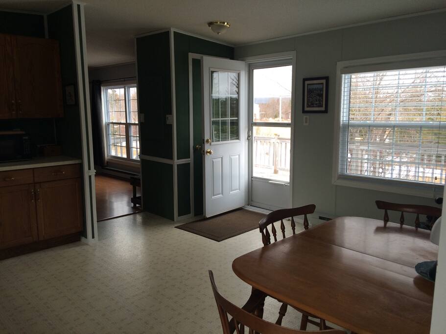 Kitchen - looking out front door (east).