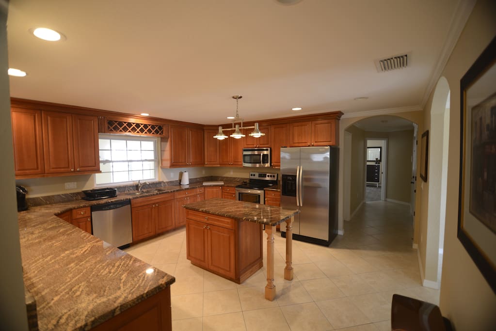 Stainless appliances & granite countertops highlight the beautiful kitchen.