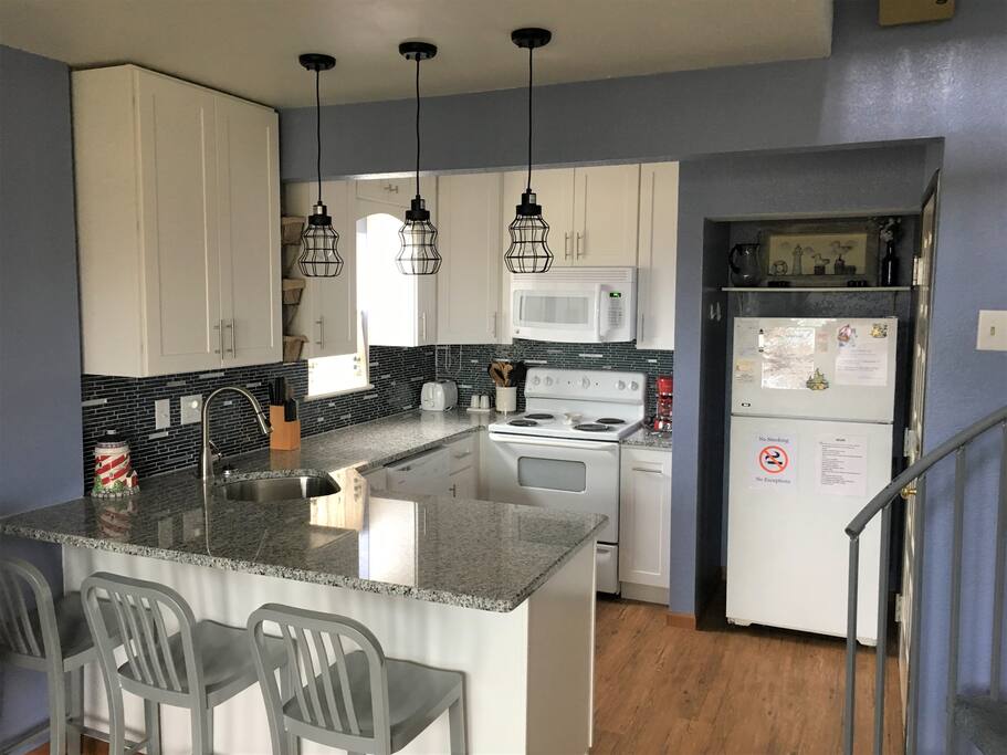 NEWLY REMODELED! Fully stocked, open view kitchen, with full sized appliances and eating area!