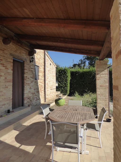 The lovely stone portico gives welcome protection from sun and rain