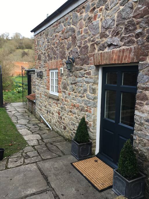 Front entrance and view up to the hills