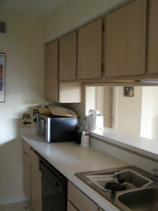 full kitchen with gas stove & large refrigerator