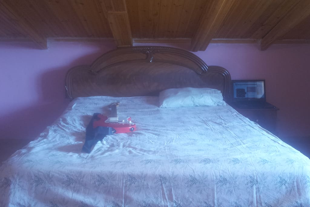 A double bed for you and your loved one, in a private room.