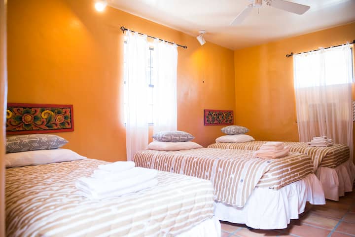 Room 1 with 4 twin beds and a private bathroom