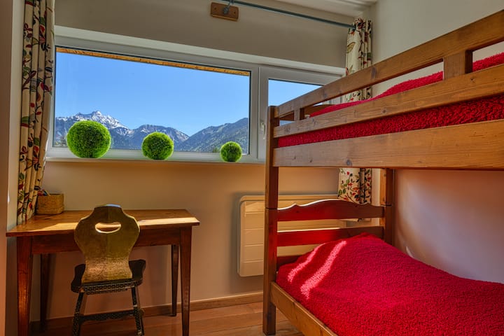 bunk beds (duplex) in the mountain corner closed by a thick curtain 